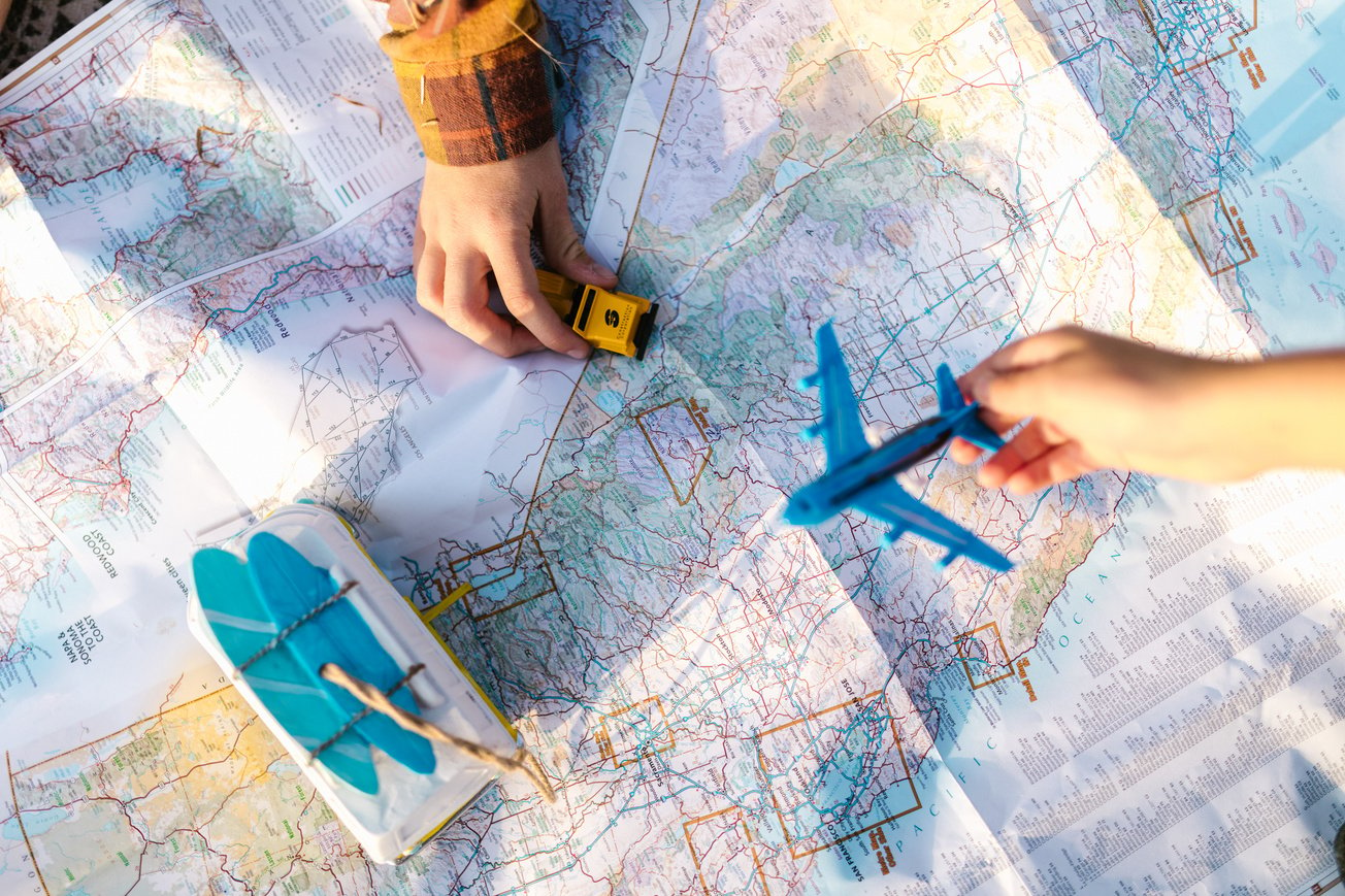 Close-Up Shot of Toys and a Map